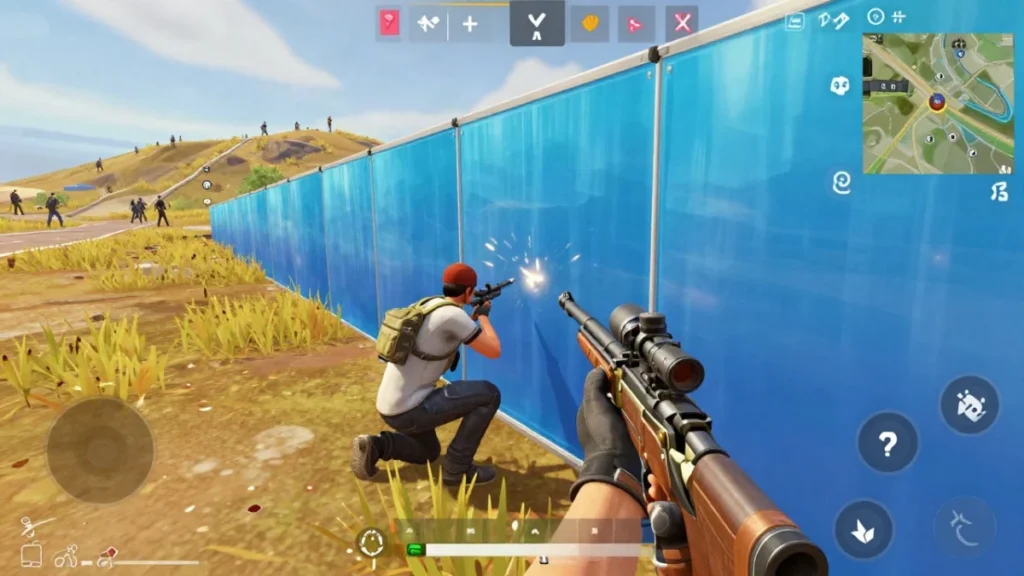 Jugador de Free Fire cubierto detrás de un muro de hielo en una ladera abierta, recargando el rifle mientras bloquea la línea de visión del enemigo.